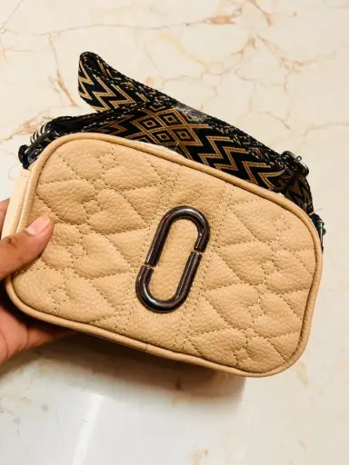 Beige quilted with gold oval hardware purse